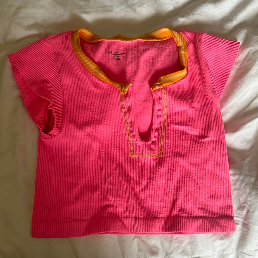 Out from under pink crop top